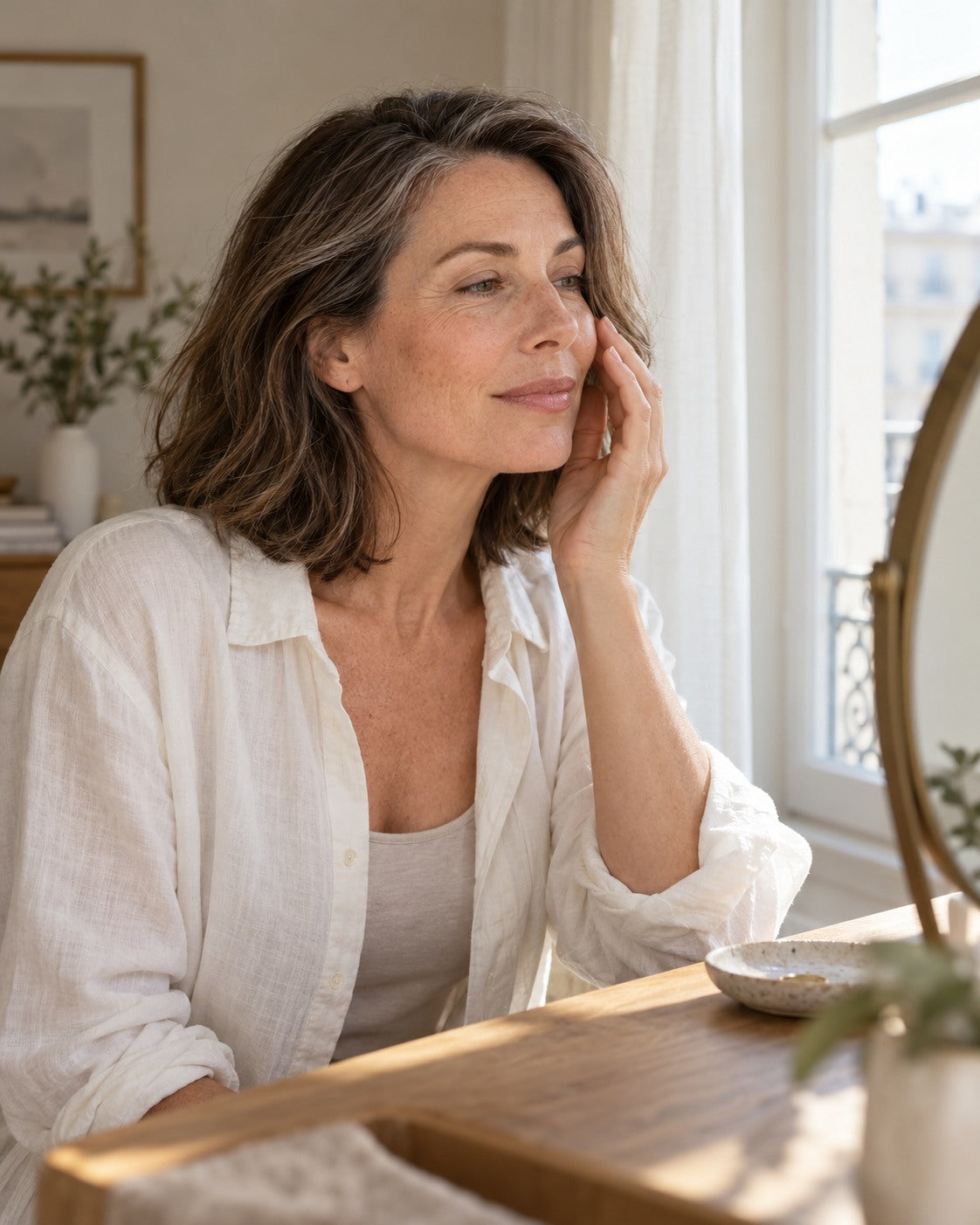A quiet moment at the mirror in a sunlit room